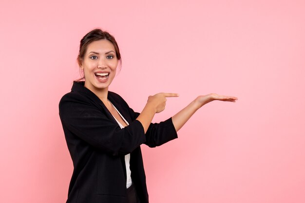 Front view young female in dark jacket on pink background