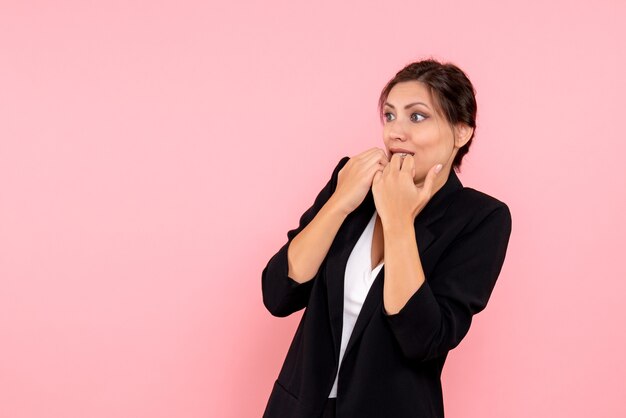 Front view young female in dark jacket on pink background