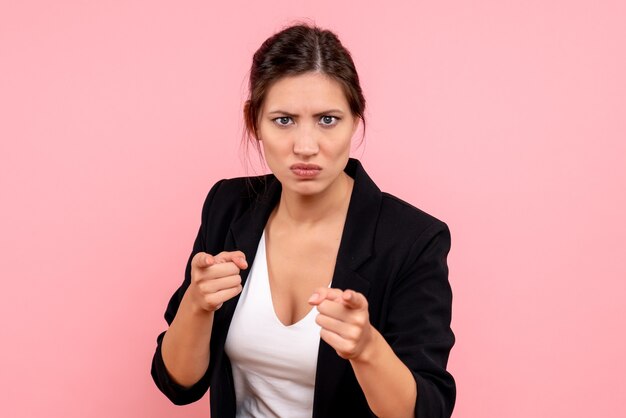 Front view young female in dark jacket on pink background