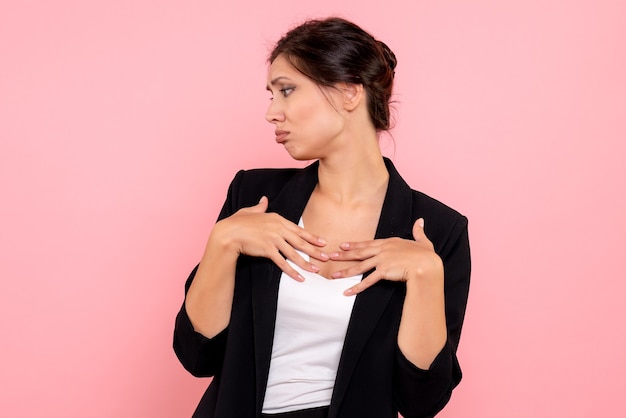 Free photo front view young female in dark jacket on pink background