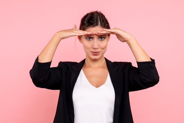 Free photo front view young female in dark jacket on pink background