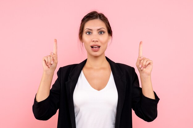 Front view young female in dark jacket on pink background