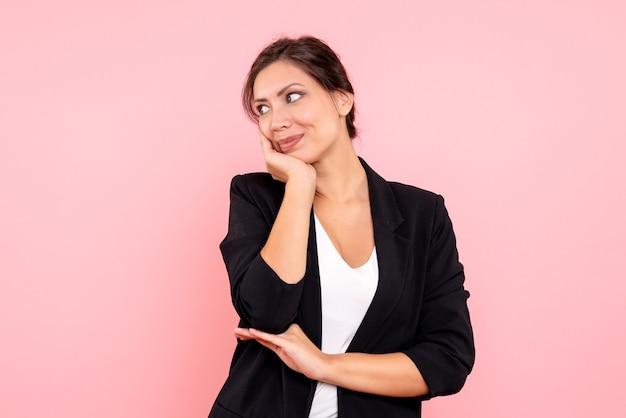 Free photo front view young female in dark jacket on pink background