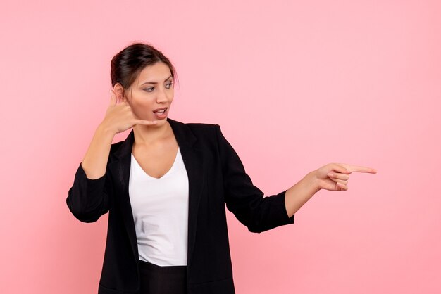 Front view young female in dark jacket on pink background