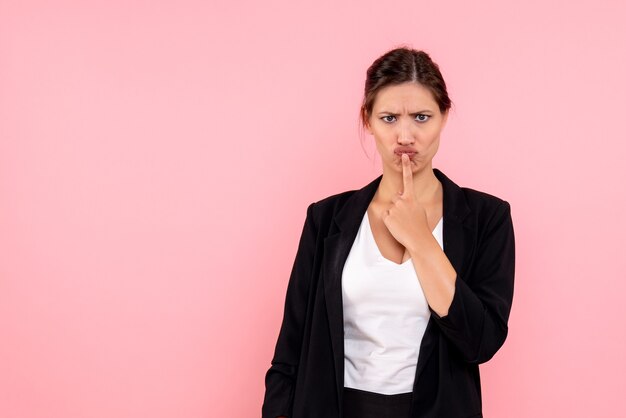 Front view young female in dark jacket on pink background