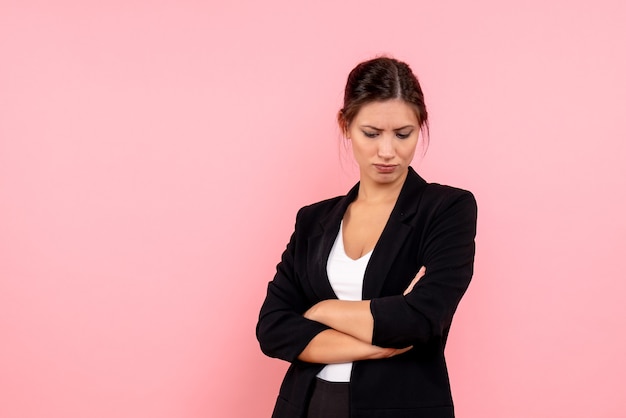 Front view young female in dark jacket on pink background