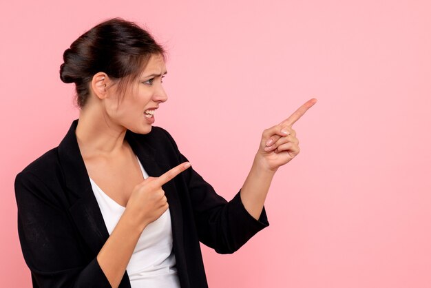 Front view young female in dark jacket on pink background