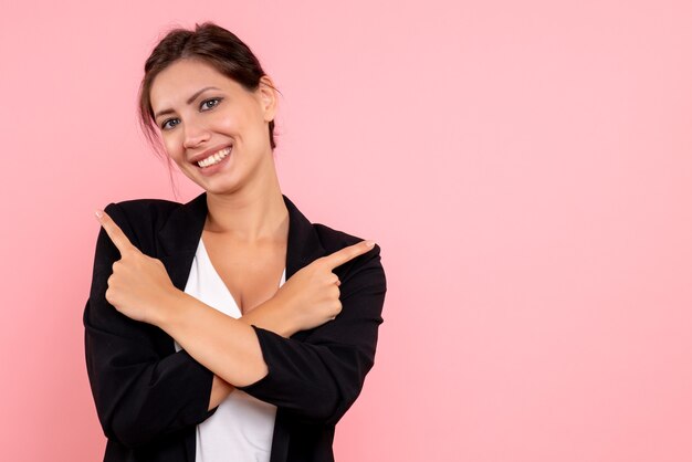 Front view young female in dark jacket on pink background