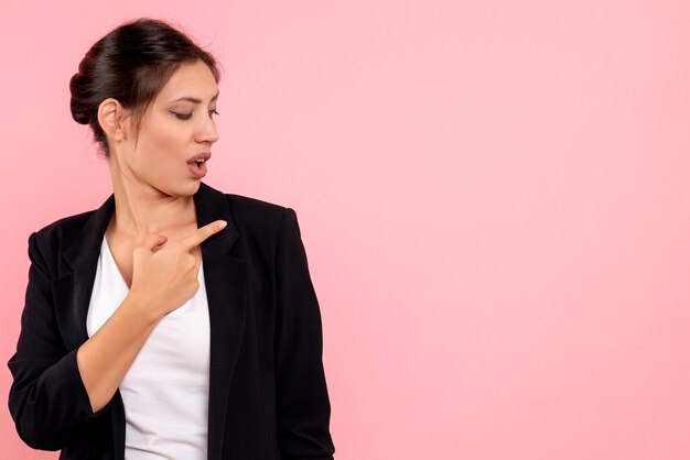 Front view young female in dark jacket on pink background