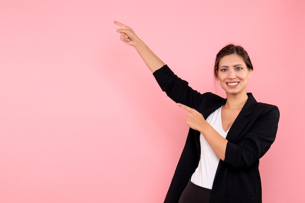 Front view young female in dark jacket on pink background