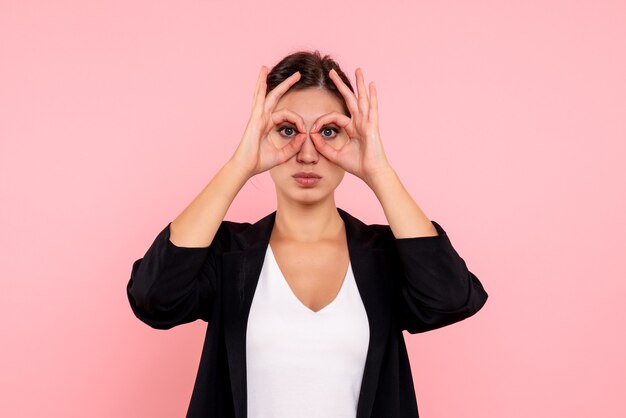 Front view young female in dark jacket on pink background