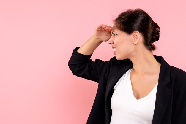 Front view young female in dark jacket on pink background