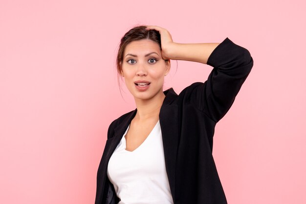 Front view young female in dark jacket on pink background