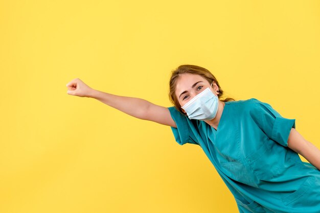 Front view of young female doctor posing