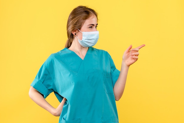 Front view of young female doctor posing