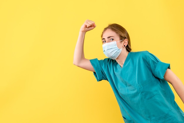 Front view of young female doctor rejoicing