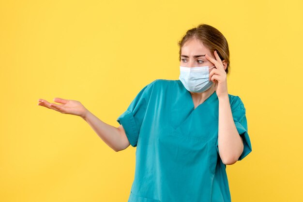 Front view of young female doctor stressed