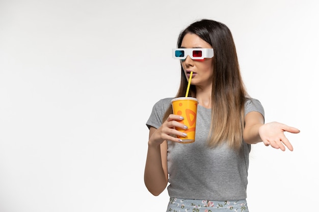 Front view young female drinking soda in d sunglasses on white surface