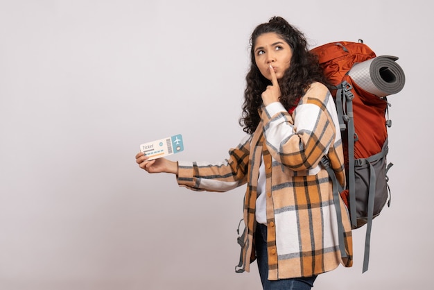 Front view young female going in hiking holding ticket on white background trip air tourist forest vacation campus mountain