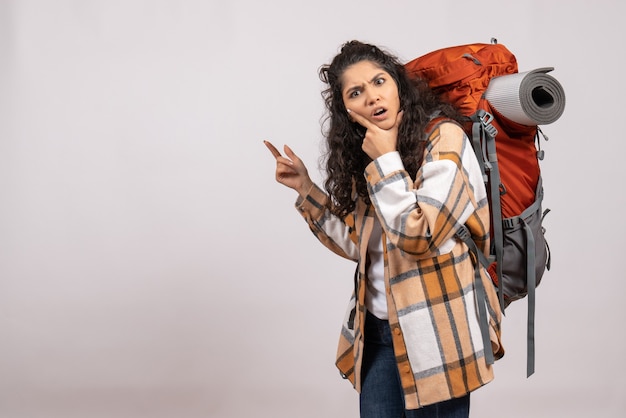 Free photo front view young female going in hiking with backpack on a white background forest trip vacation mountain air tourist campus