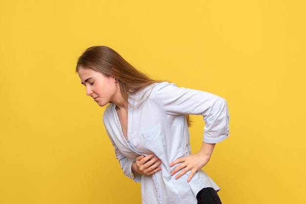 Free photo front view of young female having stomachache