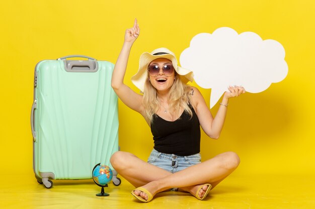 Front view young female holding huge white speech bubble