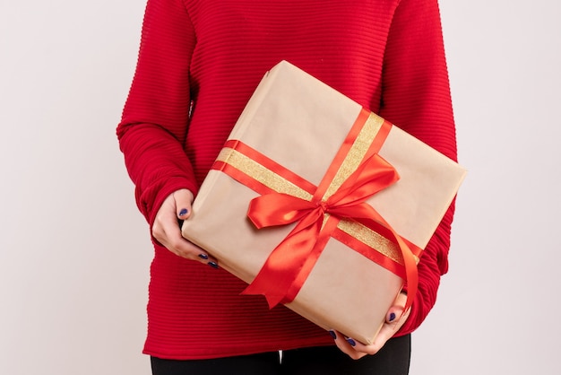 Front view young female holding present