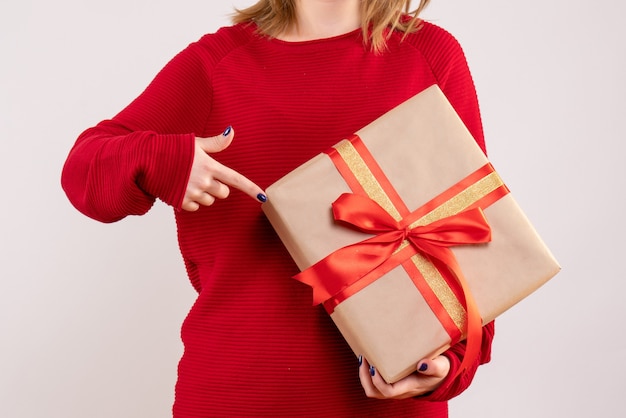 Front view young female holding present