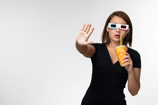 Front view young female holding soda in d sunglasses on white desk