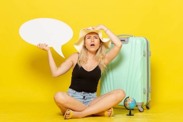 Front view young female holding white speech bubble