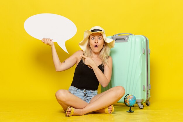 Front view young female holding white speech bubble