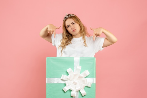 Front view young female inside blue present box