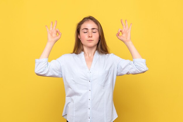 Front view of young female meditating