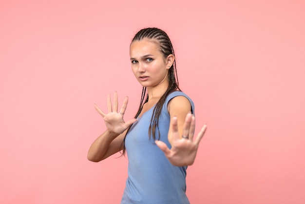 Front view of young female on pink emotion model hair youth girl