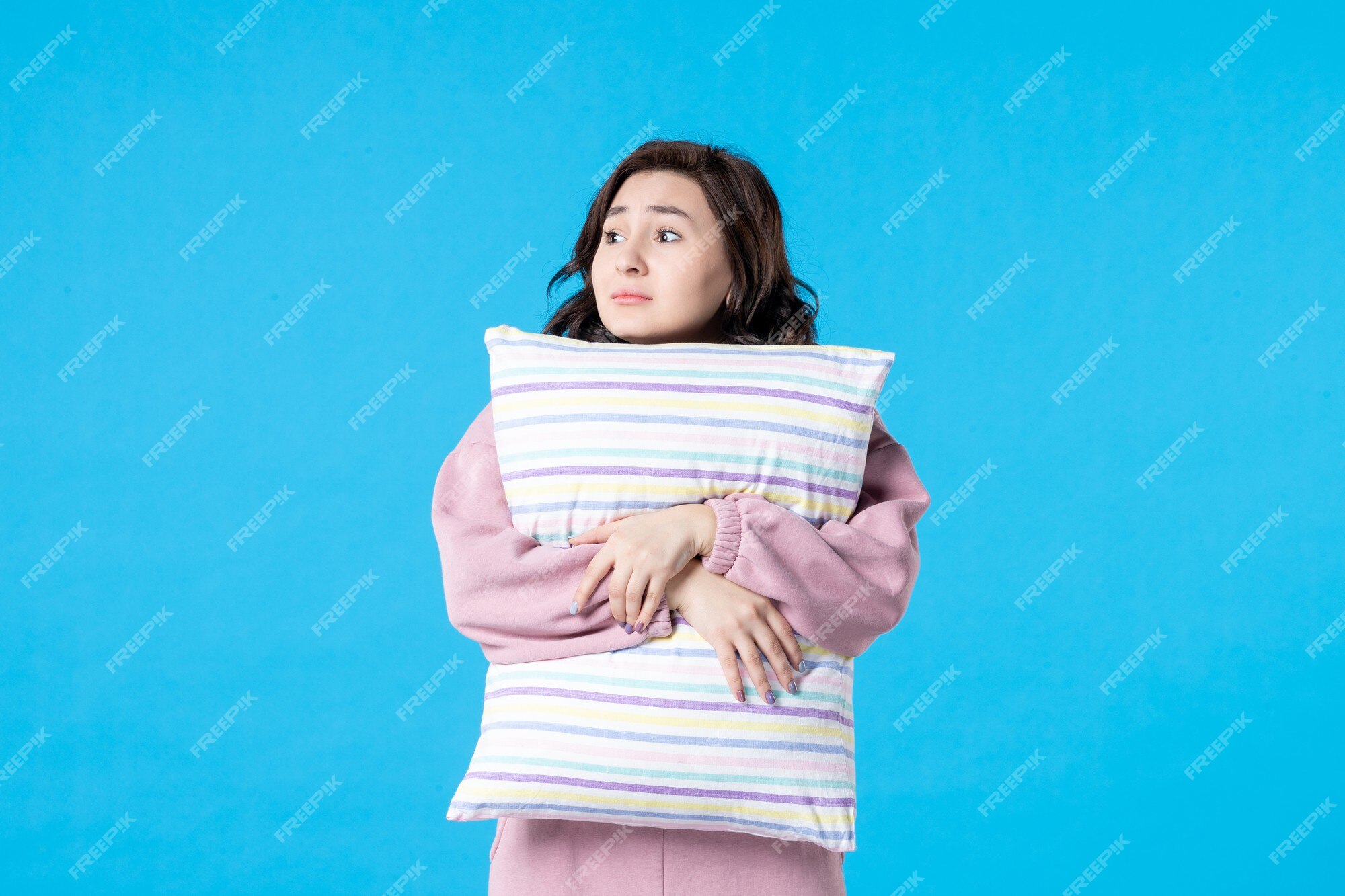 https://img.freepik.com/free-photo/front-view-young-female-pink-pajamas-holding-pillow-blue-wall-night-color-bed-rest-sleep-emotion-model-woman_140725-150265.jpg?w=2000