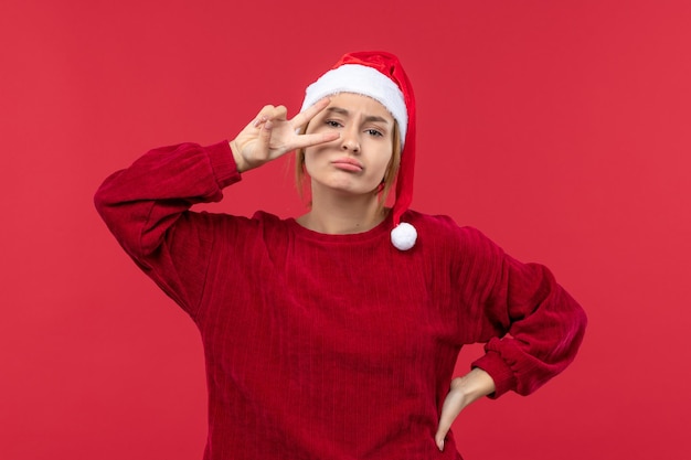 Front view young female posing, holiday red christmas