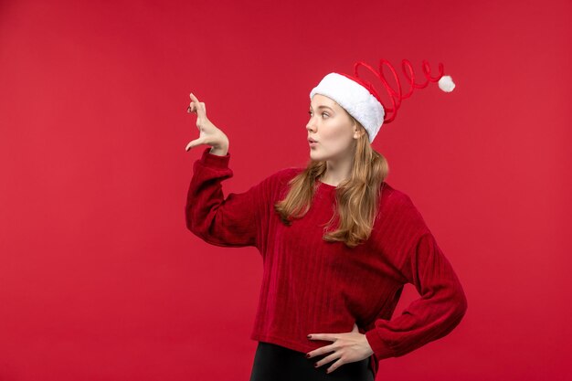 Front view young female in red cap showing size, woman holidays red