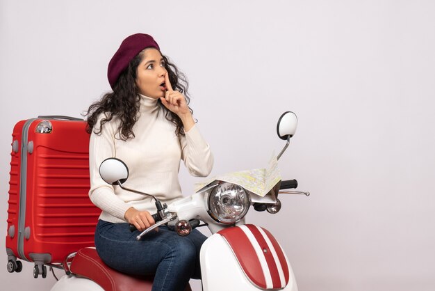 Front view young female sitting on bike on the white background road motorcycle vehicle city color vacation woman