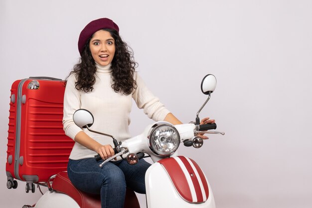 Front view young female sitting on bike on white background vehicle speed motorcycle road woman city color