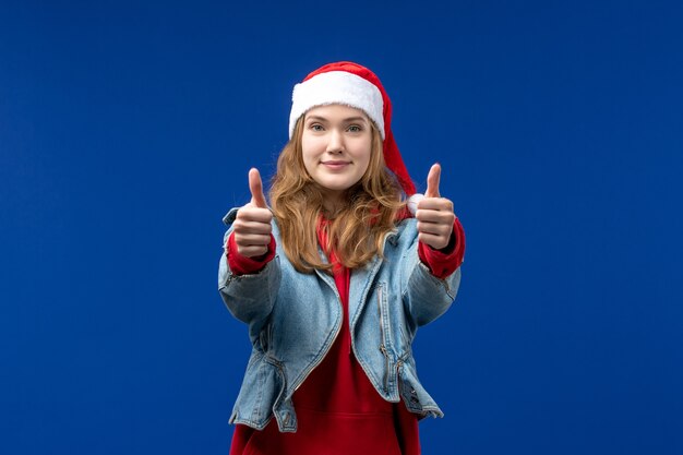 Front view young female smiling on blue background christmas emotion color