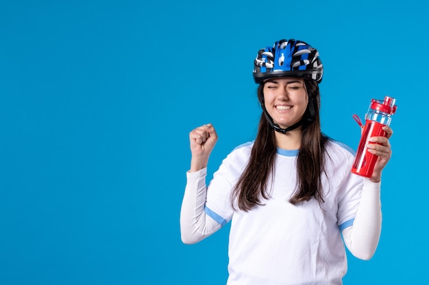 Front view young female in sport clothes and helmet