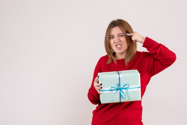 Front view young female standing with xmas present