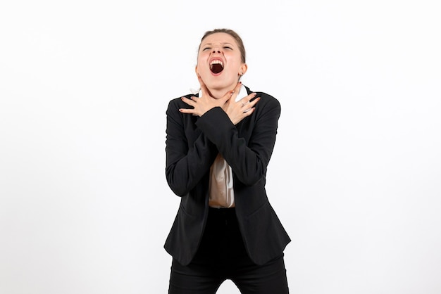 Front view young female in strict classic suit chocking herself on white background business woman work female job suit