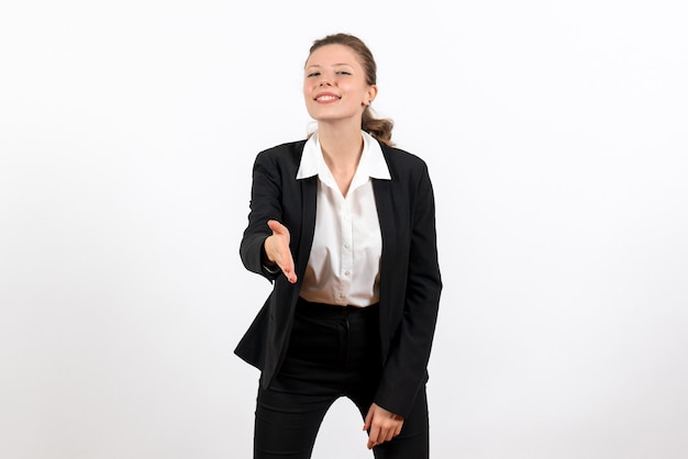 Front view young female in strict classic suit greeting someone on the white background business woman work female job suit
