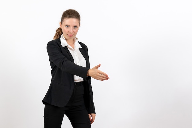 Front view young female in strict classic suit greeting someone on white background business woman work female job suit