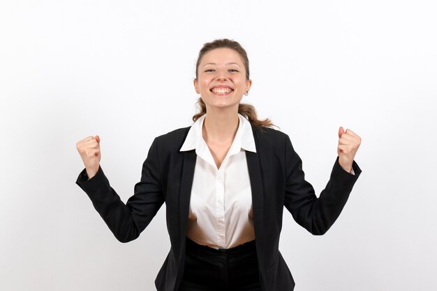 Front view young female in strict classic suit posing and rejoicing on white background job business work costume woman