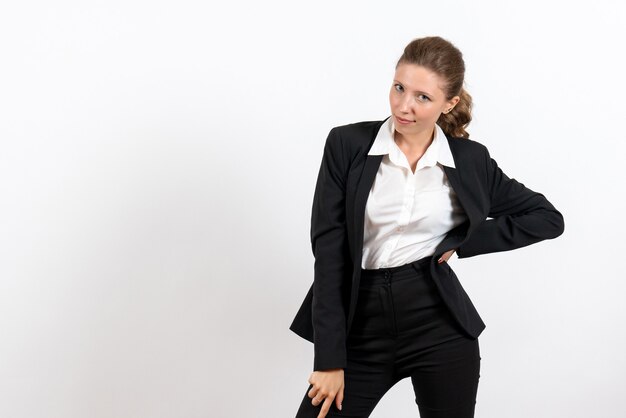 Front view young female in strict classic suit posing on a white background costume business job woman work female