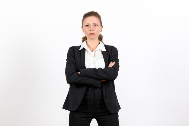 Front view young female in strict classic suit posing on a white background costume business woman job female work