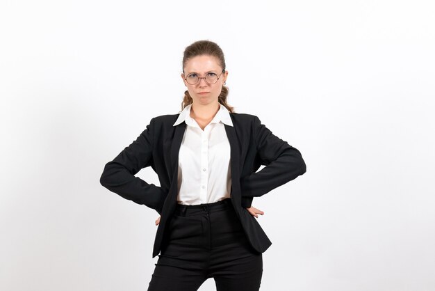Front view young female in strict classic suit posing on the white background woman job business female work costume