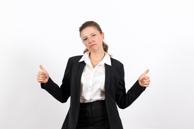 Front view young female in strict classic suit posing on the white background woman job business female work costume